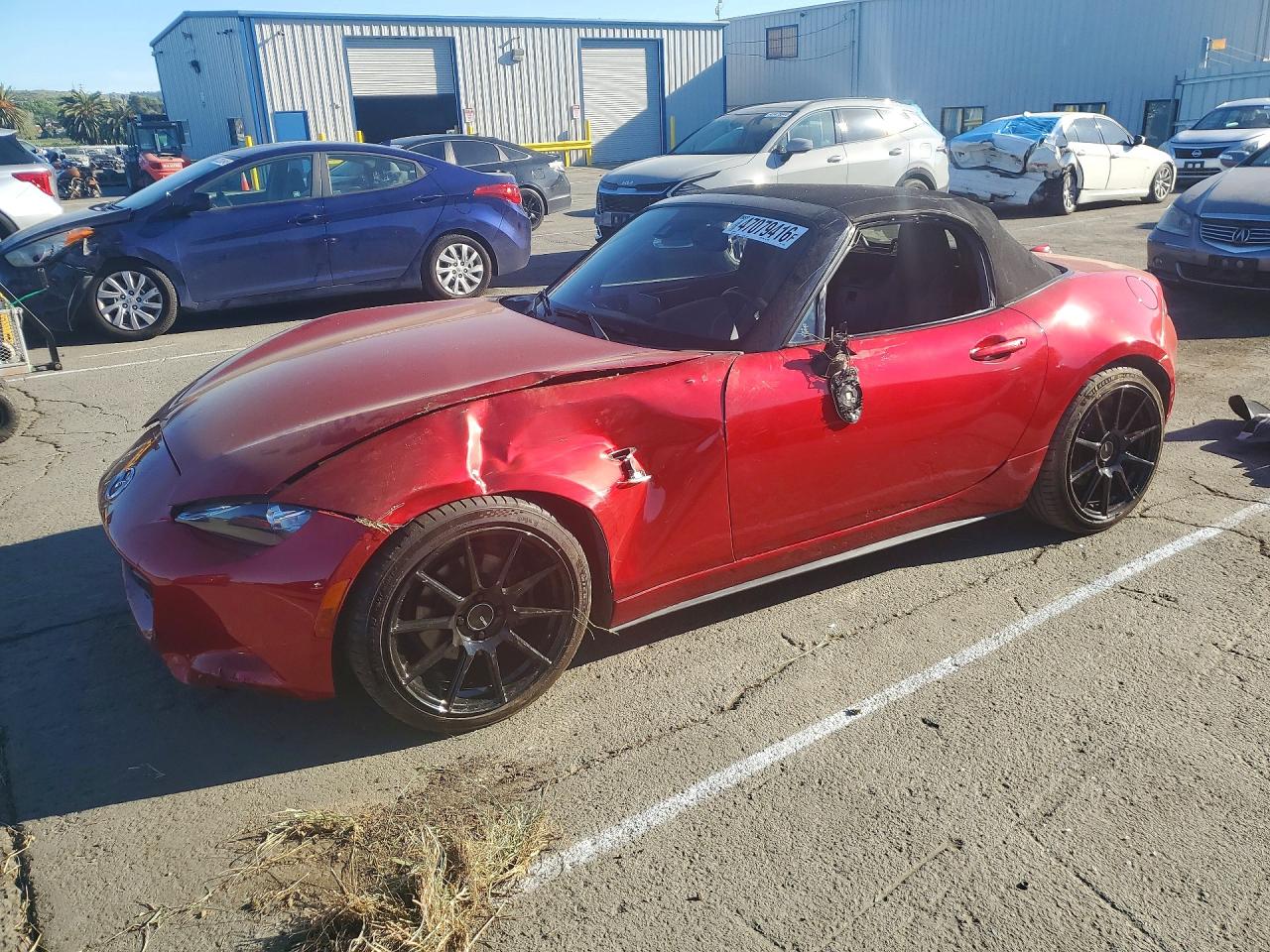 2016 Mazda MX-5 Miata Grand Touring, VIN JM1NDAD75G0118997 — Side