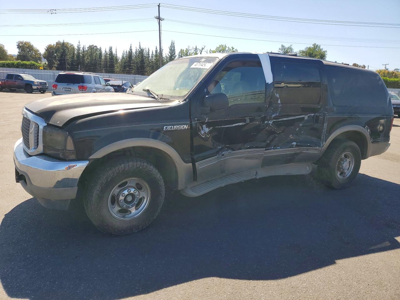 2000 Ford Excursion Limited, VIN 1FMNU42L8YEA83034 — Side