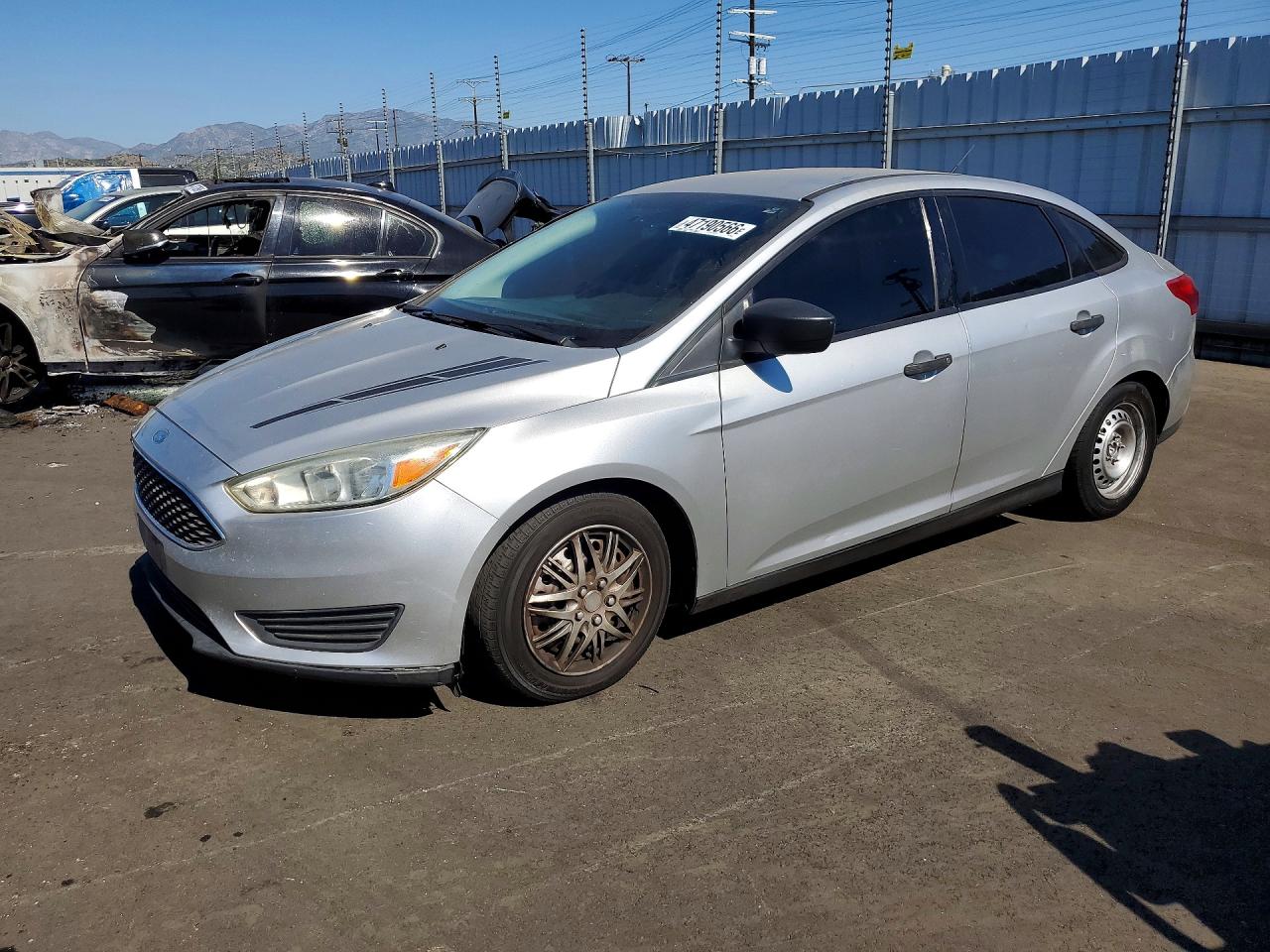 2016 Ford Focus S, VIN 1FADP3E29GL329237 — Side
