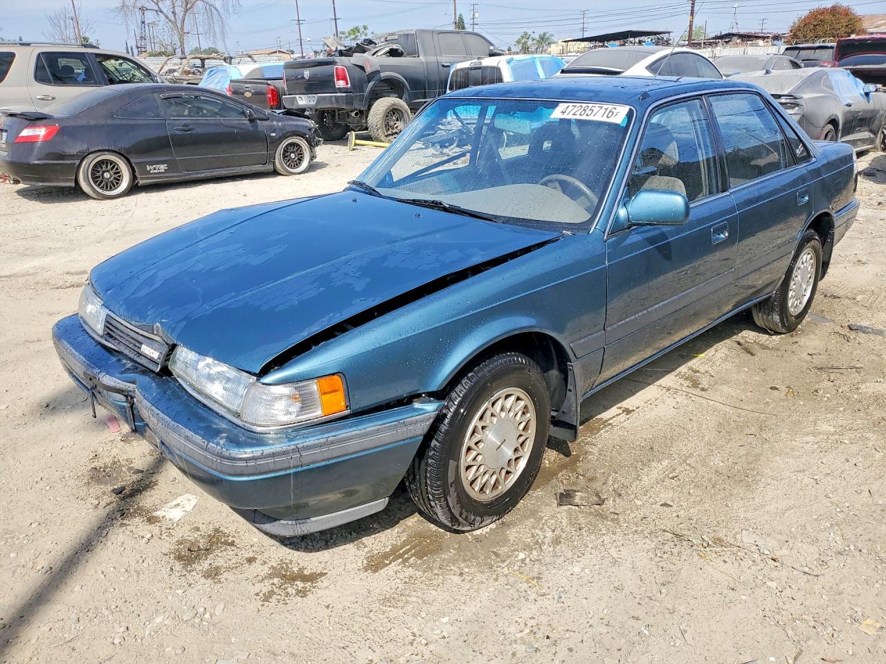1991 Mazda 626, VIN JM1GD2223M1911159 — Side