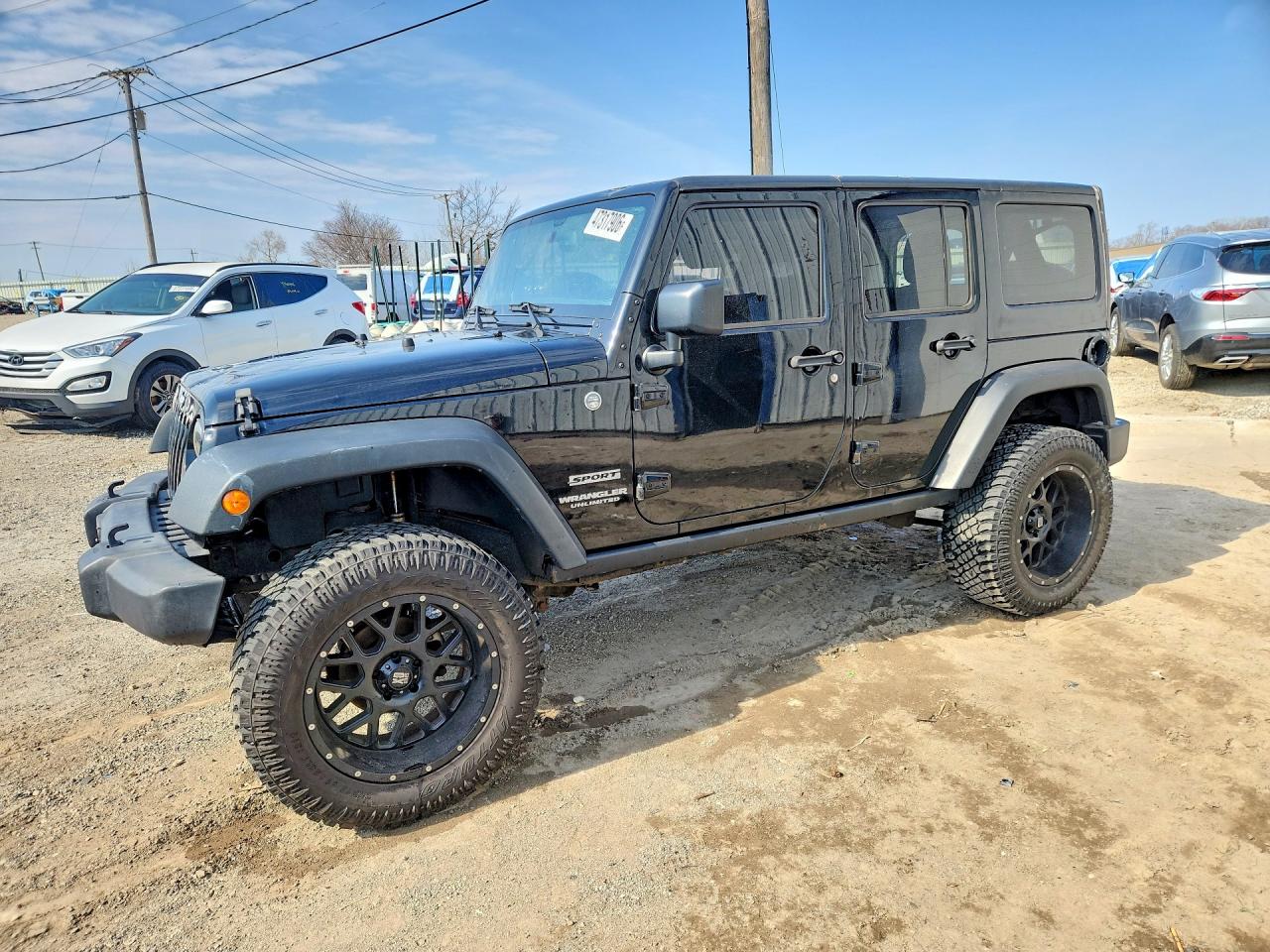 2015 Jeep Wrangler Unlimited Sport, VIN 1C4BJWDG2FL613311 — Град