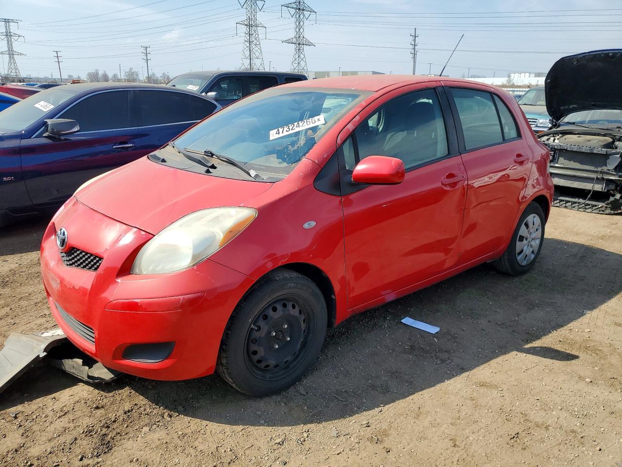 2011 Toyota Yaris, VIN JTDKT4K35B5337798 — Side