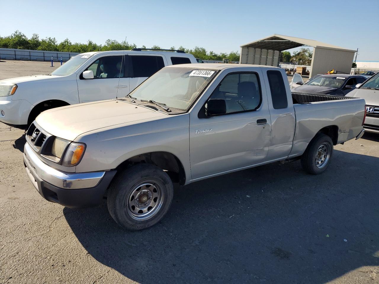 1999 Nissan Frontier XE, VIN 1N6DD26S3XC318209 — Side