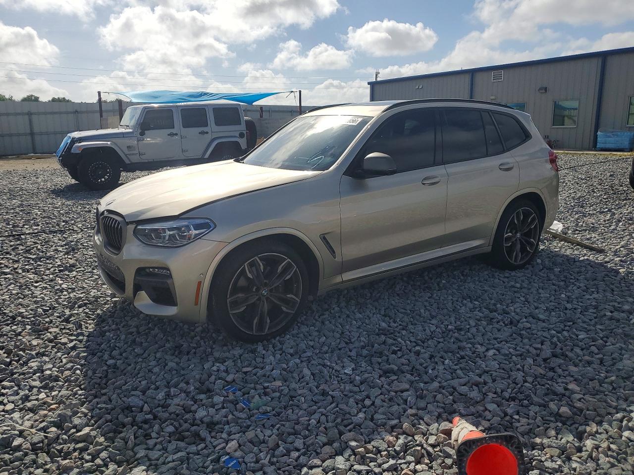 2021 BMW X3 M40i, VIN 5UXTY9C01M9G65997 — Side