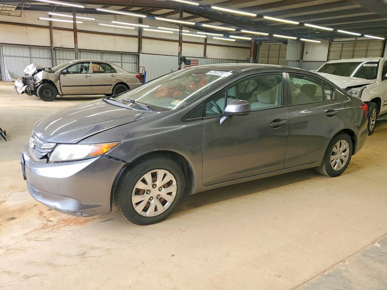 2012 Honda Civic LX, VIN 2HGFB2F57CH304897 — Prior damage history