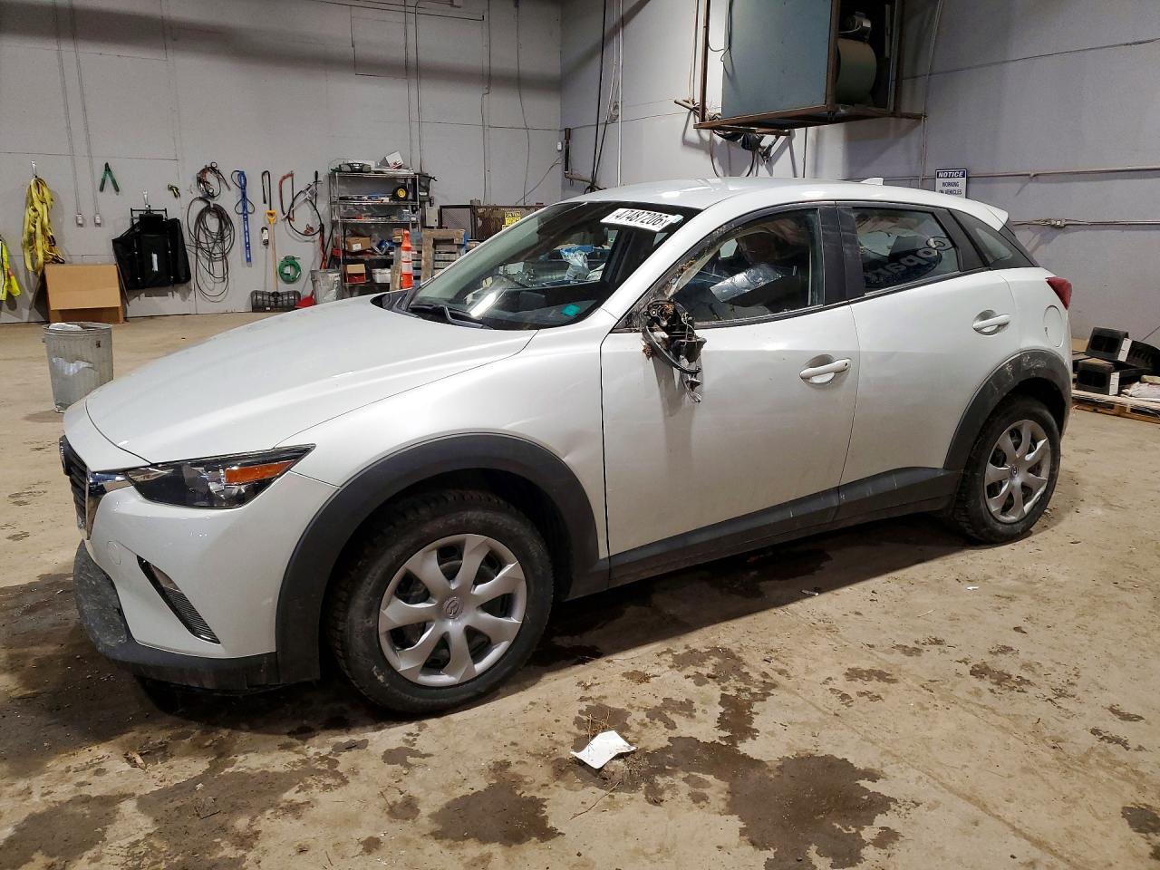 2019 Mazda CX-3 Sport, VIN JM1DKFB70K1455243 — Side