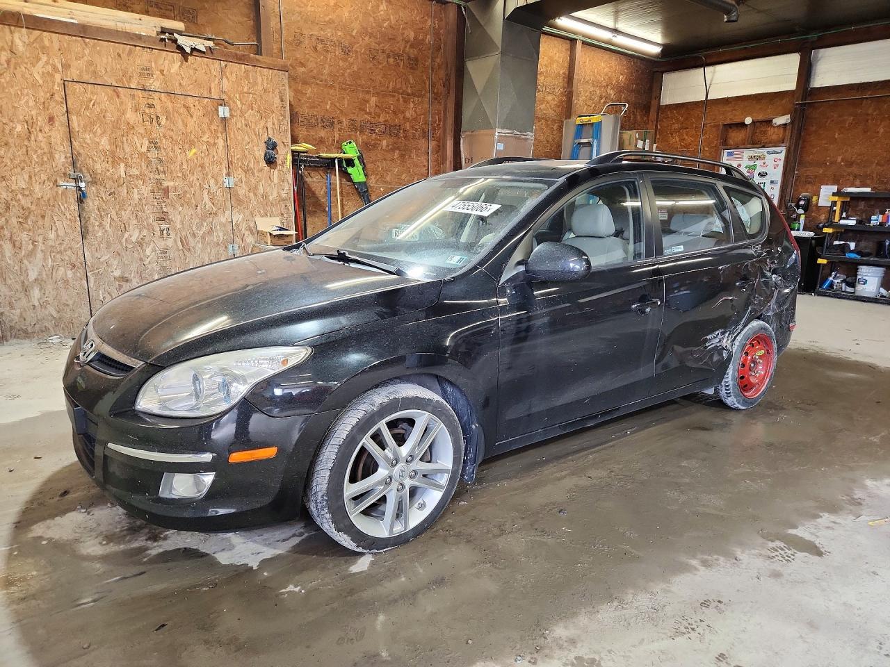 2010 Hyundai Elantra SE, VIN KMHDC8AE2AU063060 — Rear end