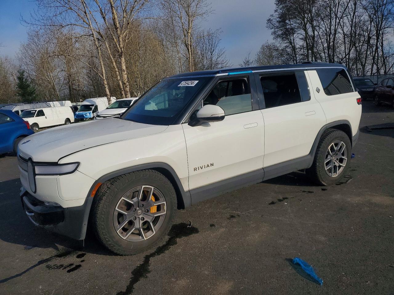 2023 Rivian R1S Adventure, VIN 7PDSGABA4PN017518 — Side