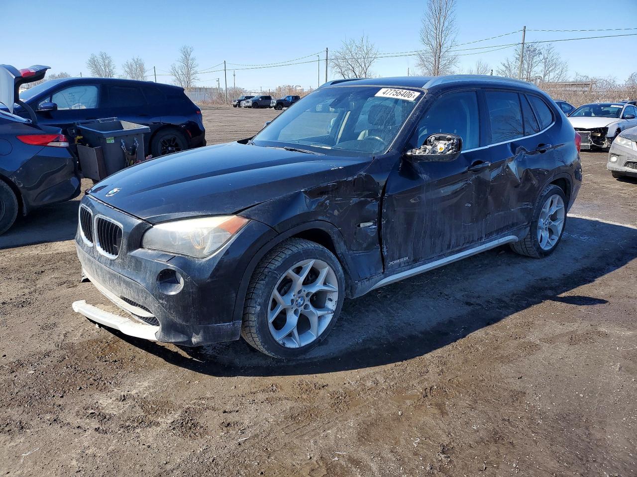 2012 BMW X1 28i, VIN WBAVL1C55CVR77889 — Side