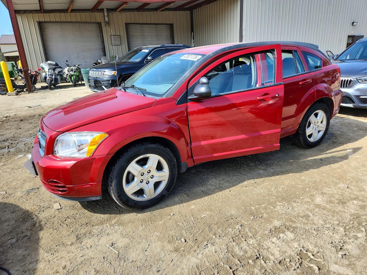 2009 Dodge Caliber SXT, VIN 1B3HB48A19D242997 — Бок