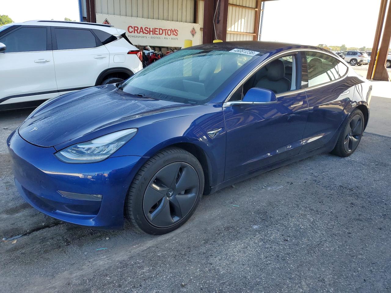 2020 Tesla Model 3 Long Range, VIN 5YJ3E1EB9LF803104 — Бок