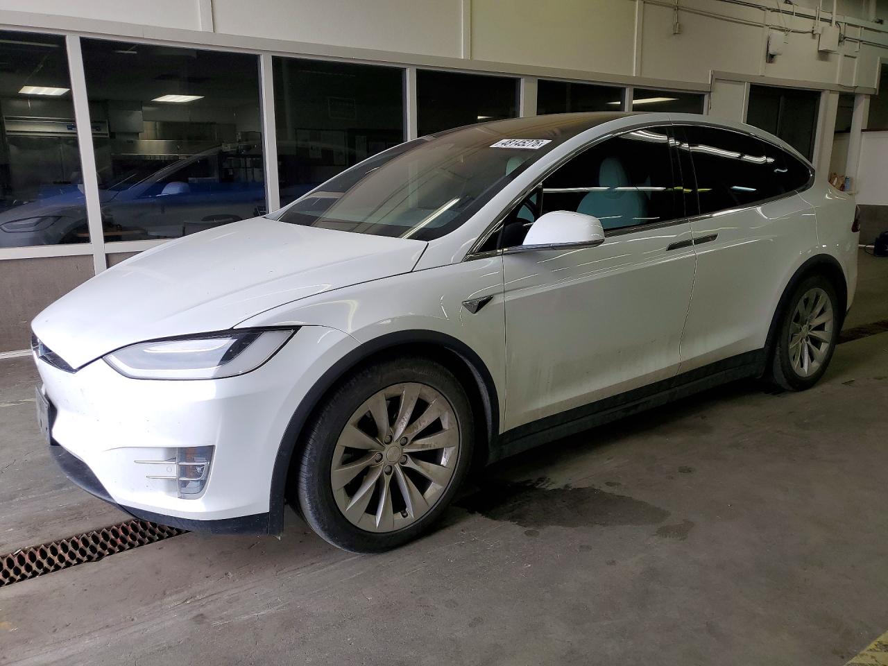 2021 Tesla Model X Long Range Plus, VIN 5YJXCDE28MF324005 — Side