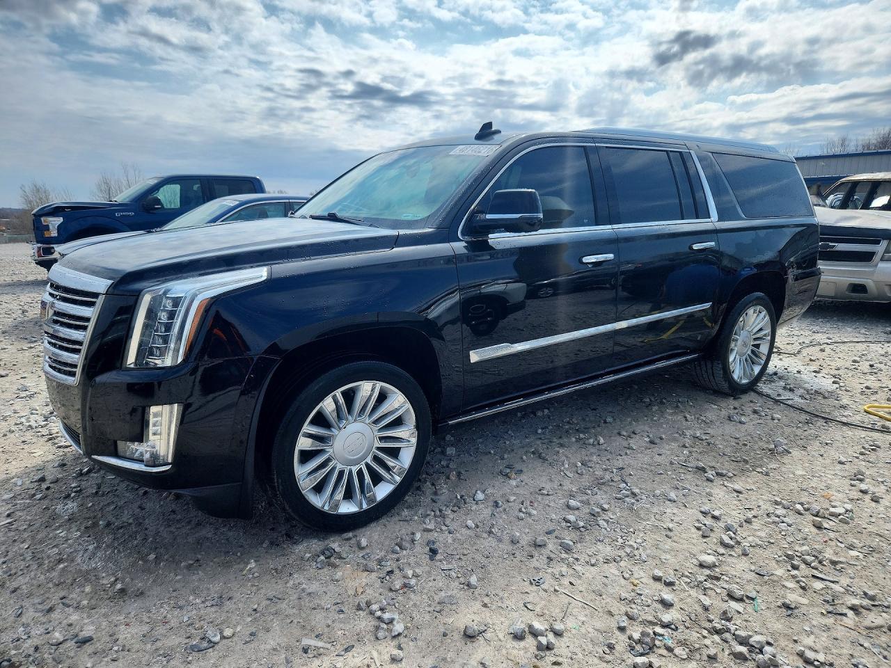 2015 Cadillac Escalade ESV Platinum, VIN 1GYS4UKJ2FR747673 — Hail