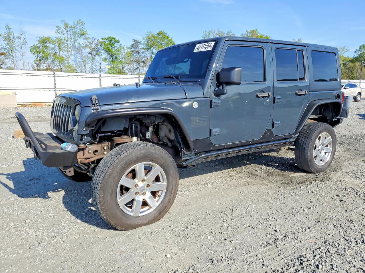 2017 Jeep Wrangler Unlimited Willys Wheeler, VIN 1C4BJWDG2HL561987 — Front end