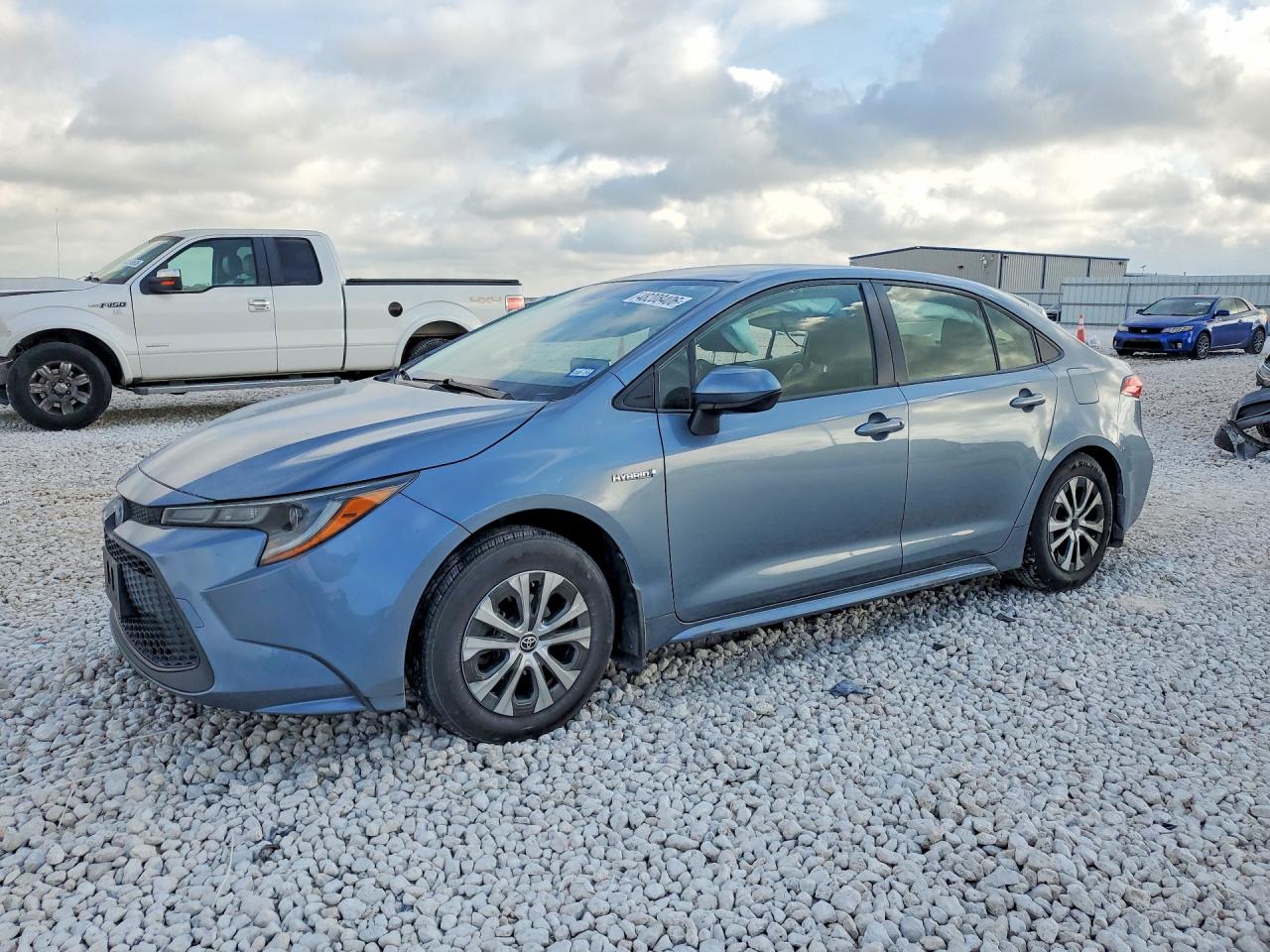 2021 Toyota Corolla Hybrid LE, VIN JTDEAMDE1MJ007149 — Side
