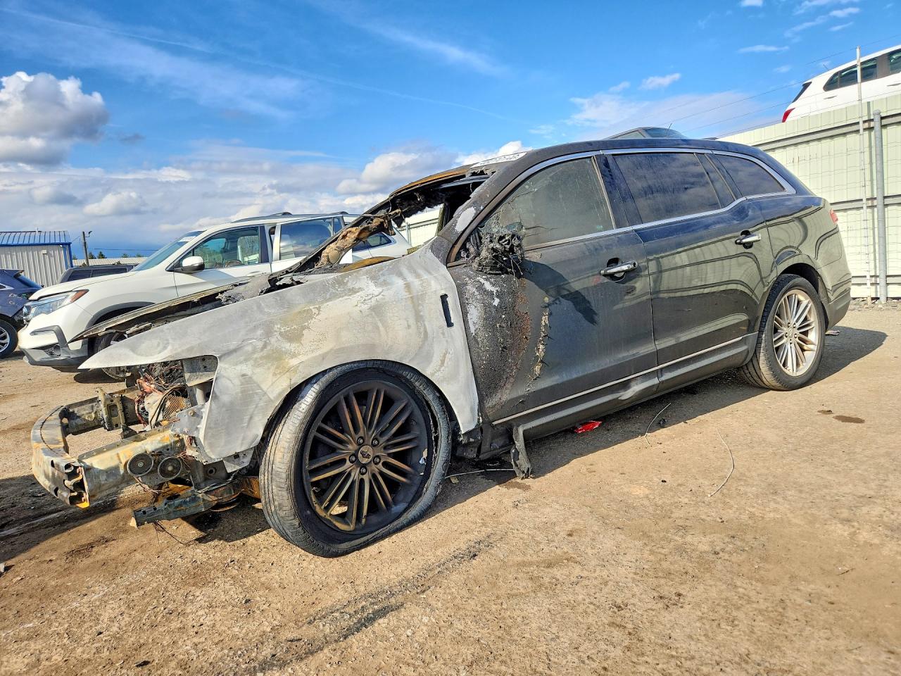 2014 Lincoln MKT EcoBoost, VIN 2LMHJ5AT1EBL58283 — Engine fire