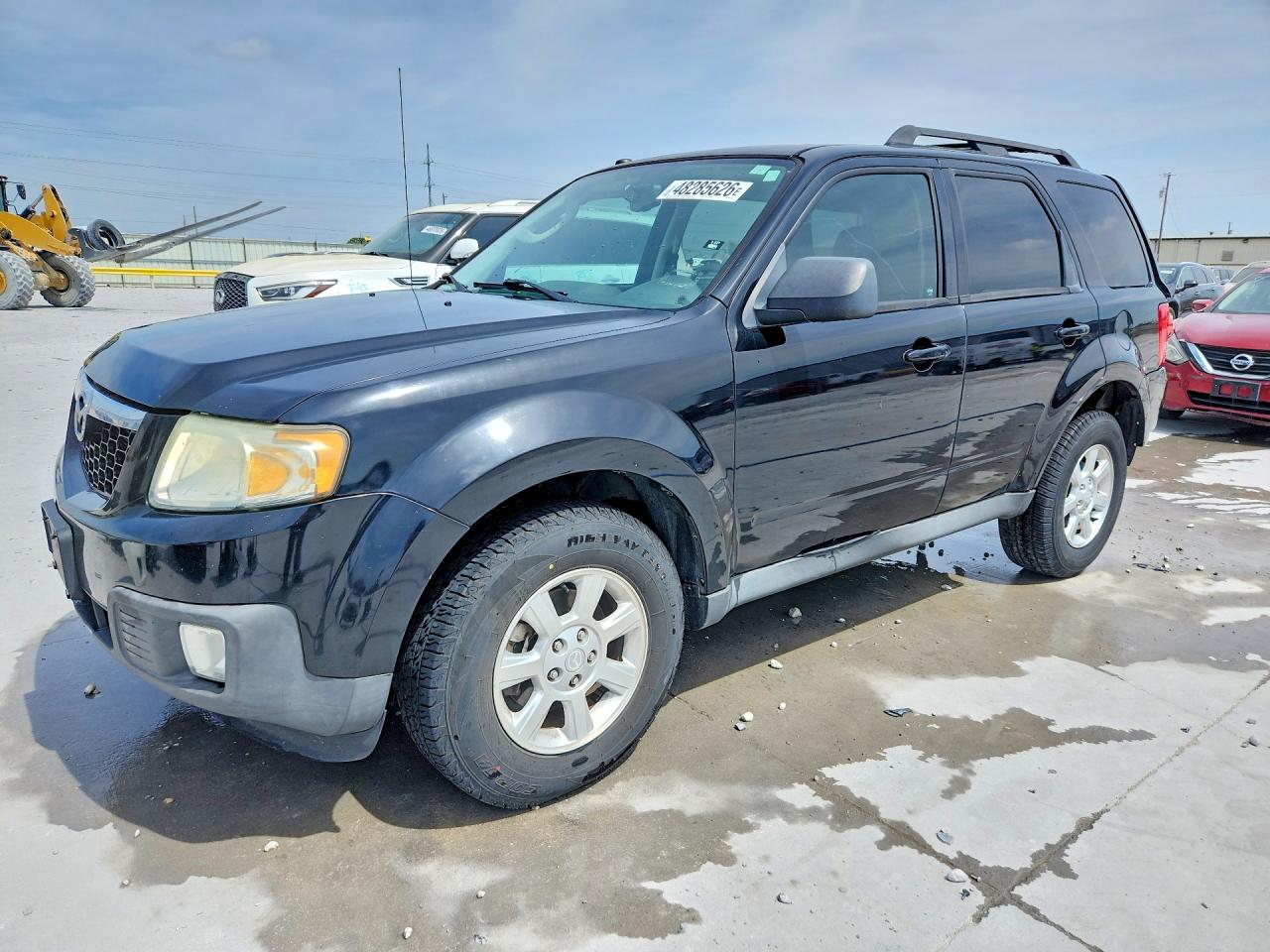 2010 Mazda Tribute Sport, VIN 4F2CY0C78AKM01736 — Зад