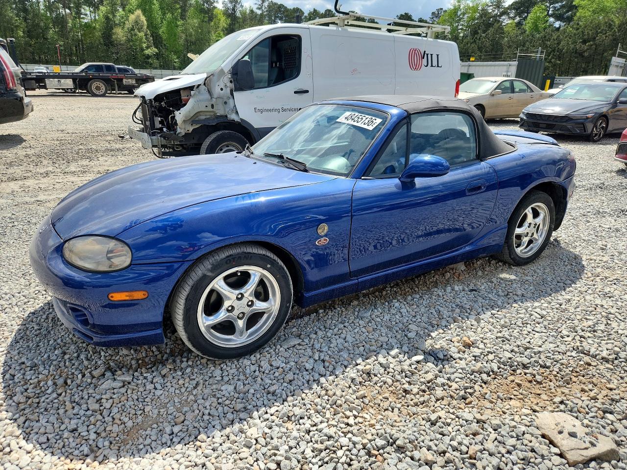 1999 Mazda MX-5 Miata, VIN JM1NB3536X0128354 — Side