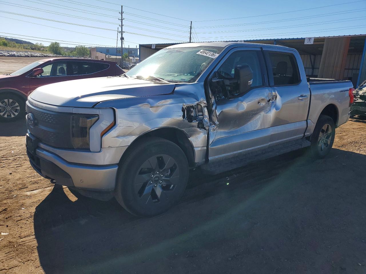 2023 Ford F-150 Lightning XLT, VIN 1FT6W1EV8PWG23182 — Side