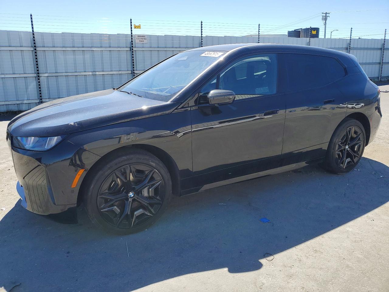 2026 BMW iX xDrive45, VIN WB543CF06TCV37620 — Side