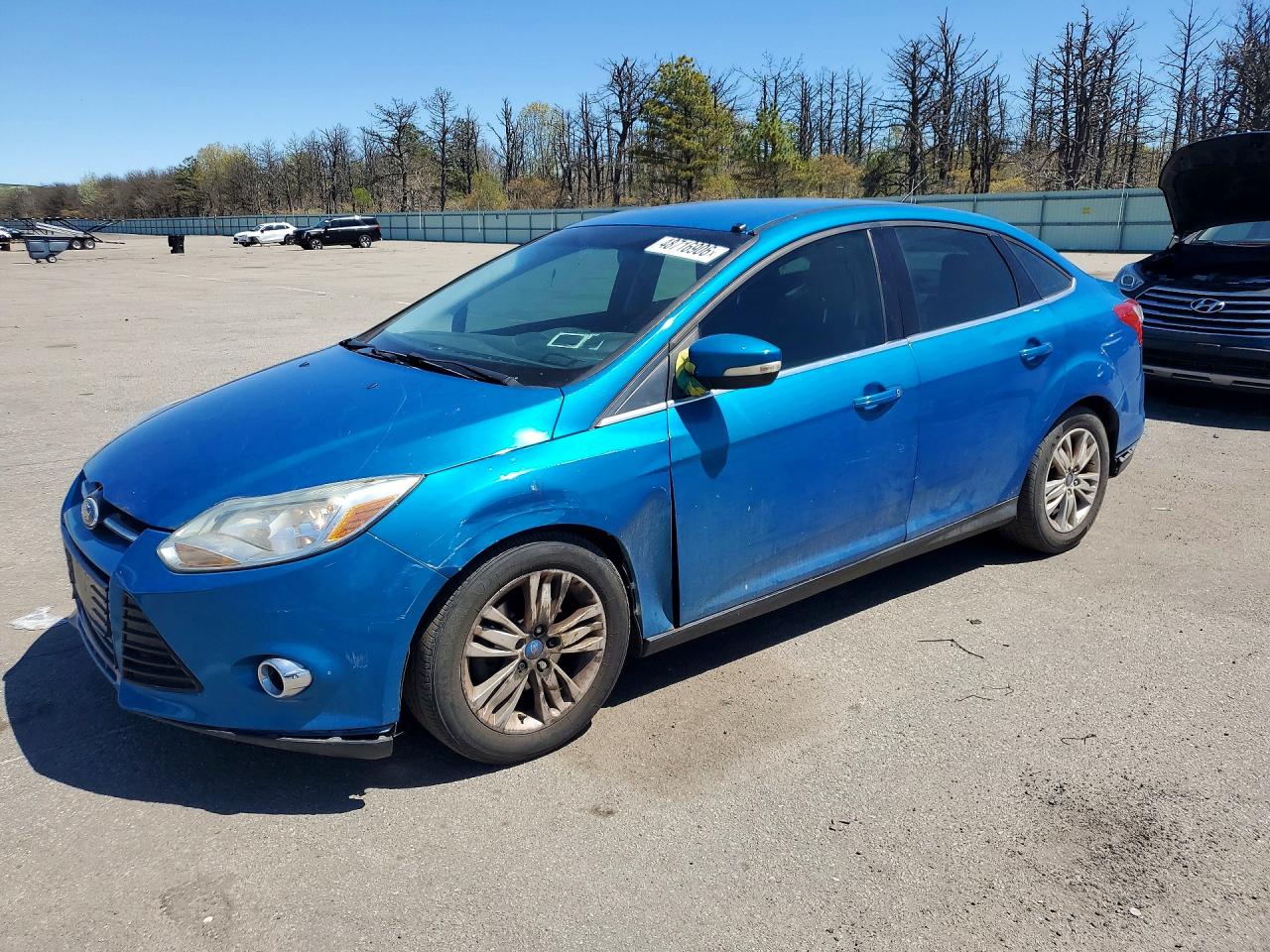 2012 Ford Focus SEL, VIN 1FAHP3H2XCL163219 — Бок