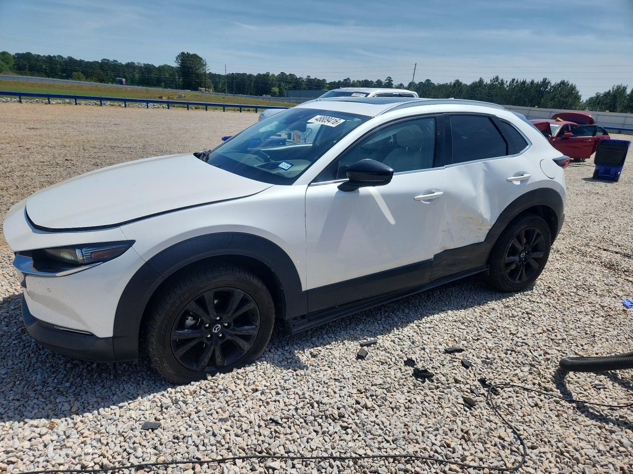 2021 Mazda CX-30 Premium Plus, VIN 3MVDMBEY0MM249304 — Side