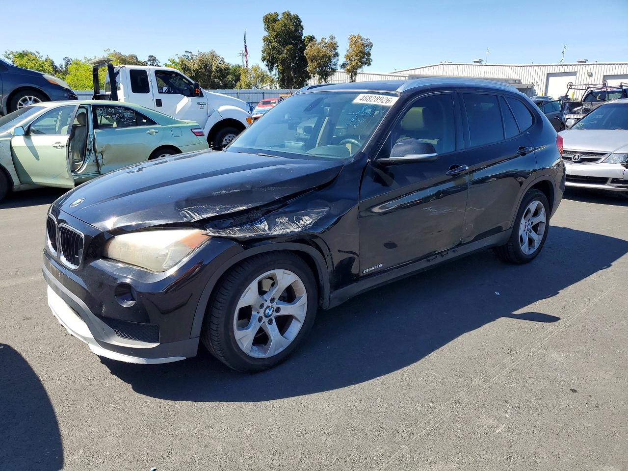 2015 BMW X1 sDrive28i, VIN WBAVM1C53FVZ93980 — Front end