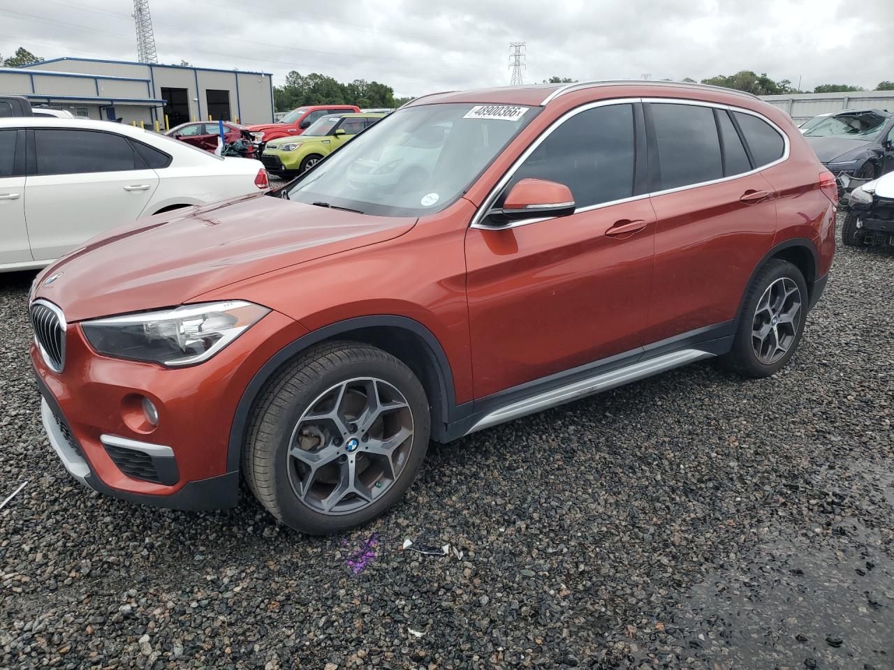 2018 BMW X1 xDrive28i, VIN WBXHT3C39J5L35007 — Side