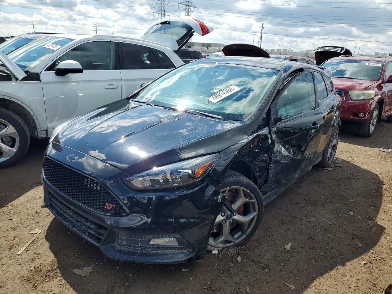 2016 Ford Focus ST, VIN 1FADP3L97GL382759 — Side