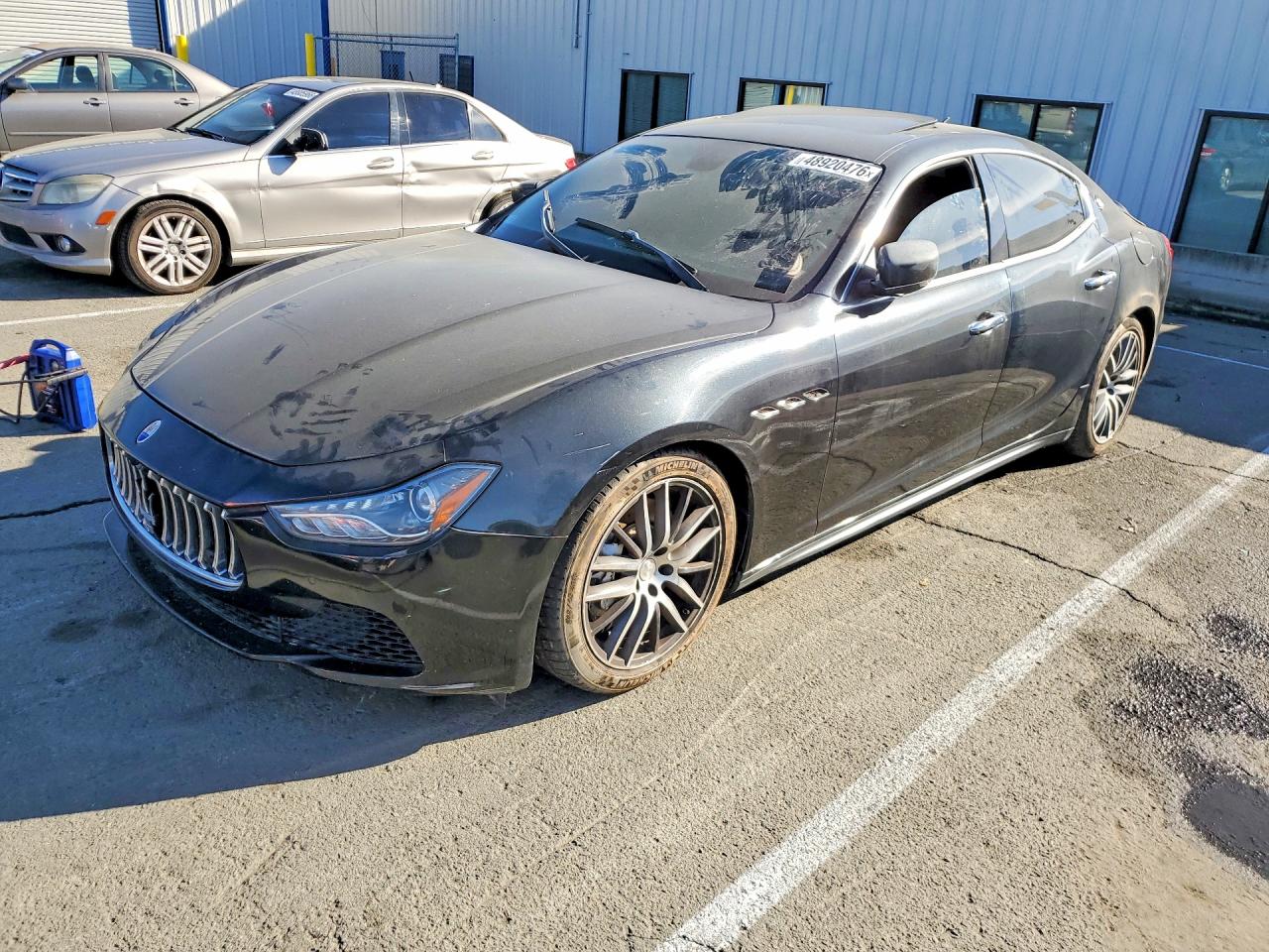 2014 Maserati Ghibli S Q4, VIN ZAM57RTA9E1085914 — Side