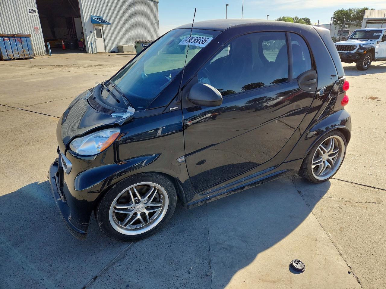 2013 Smart fortwo Pure, VIN WMEEJ3BA2DK725878 — Side