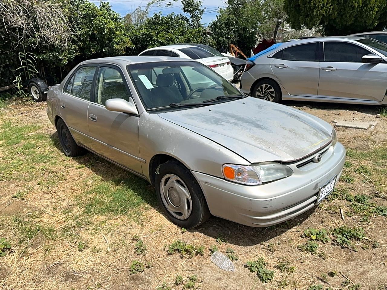 1998 Toyota Corolla LE, VIN 1NXBR18E9WZ085034 — Вандализм