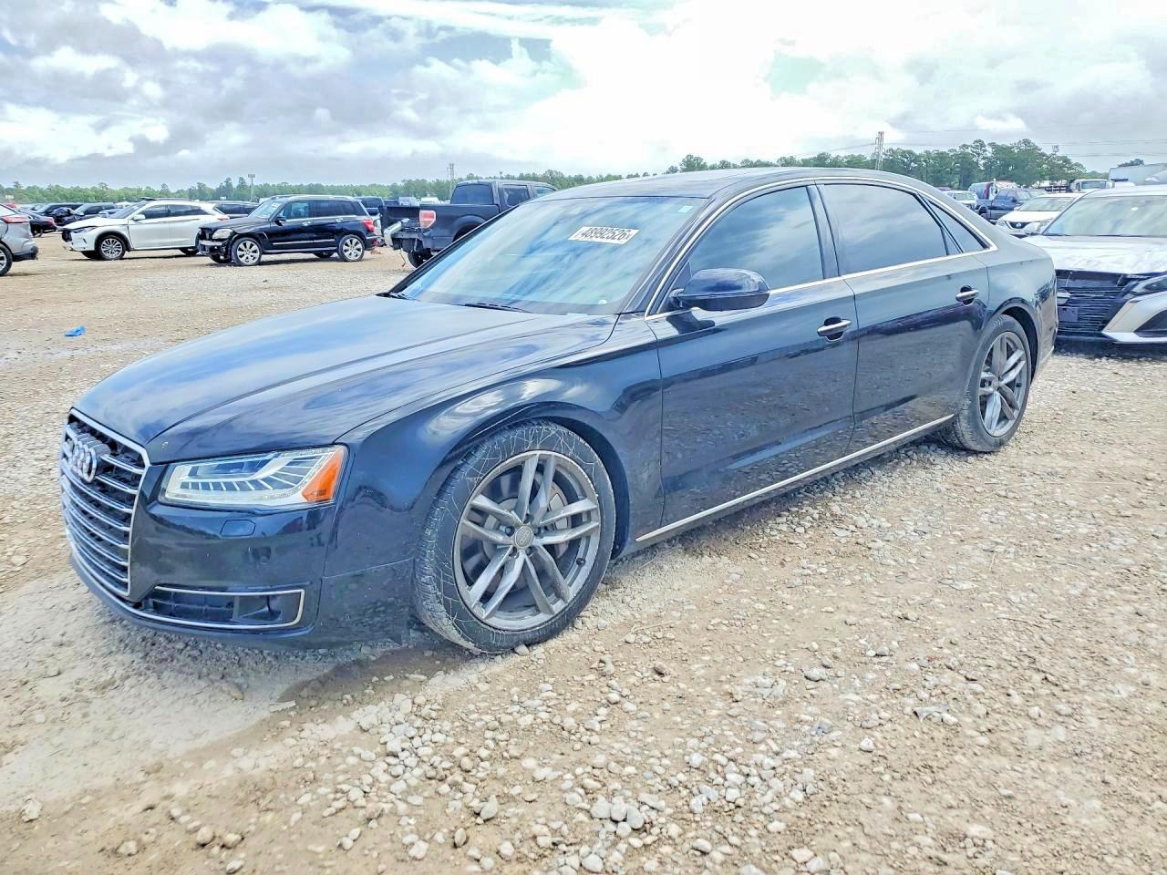 2015 Audi A8 4.0T, VIN WAU32AFDXFN028193 — Side