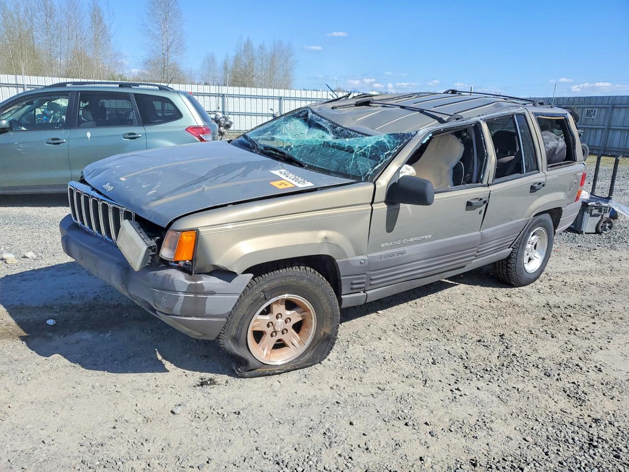 1998 Jeep Grand Cherokee Laredo, VIN 1J4GZ58S0WC110636 — Rollover