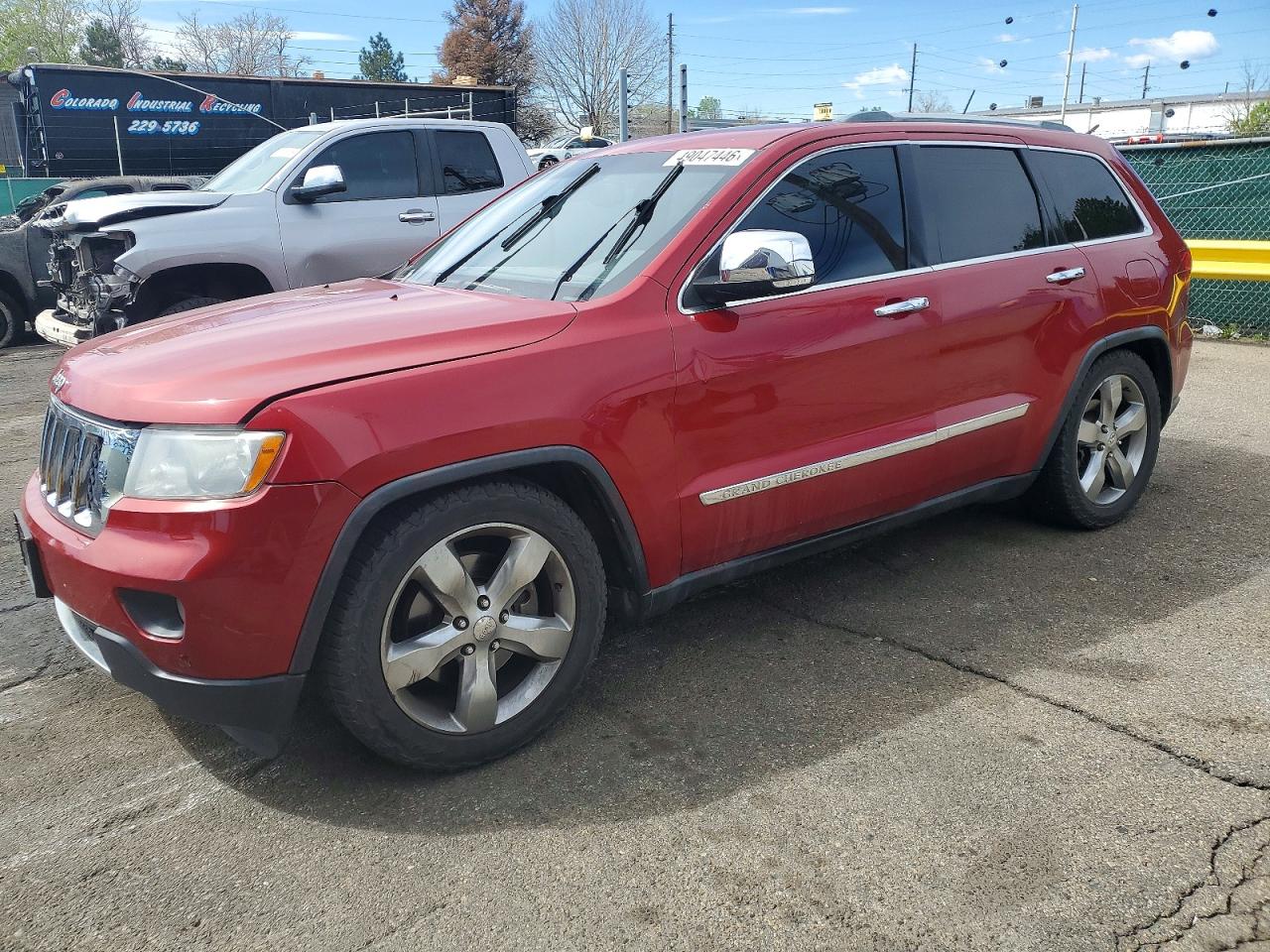 2011 Jeep Grand Cherokee Overland, VIN 1J4RR6GTXBC665211 — Side