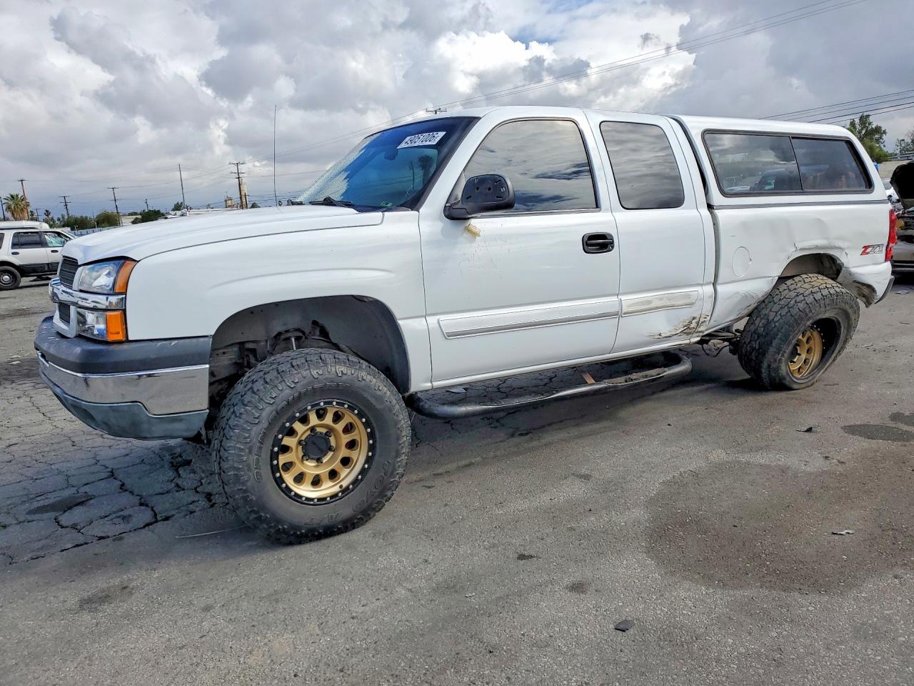 2003 Chevrolet Silverado 1500 LS, VIN 1GCEK19T93E347501 — Side