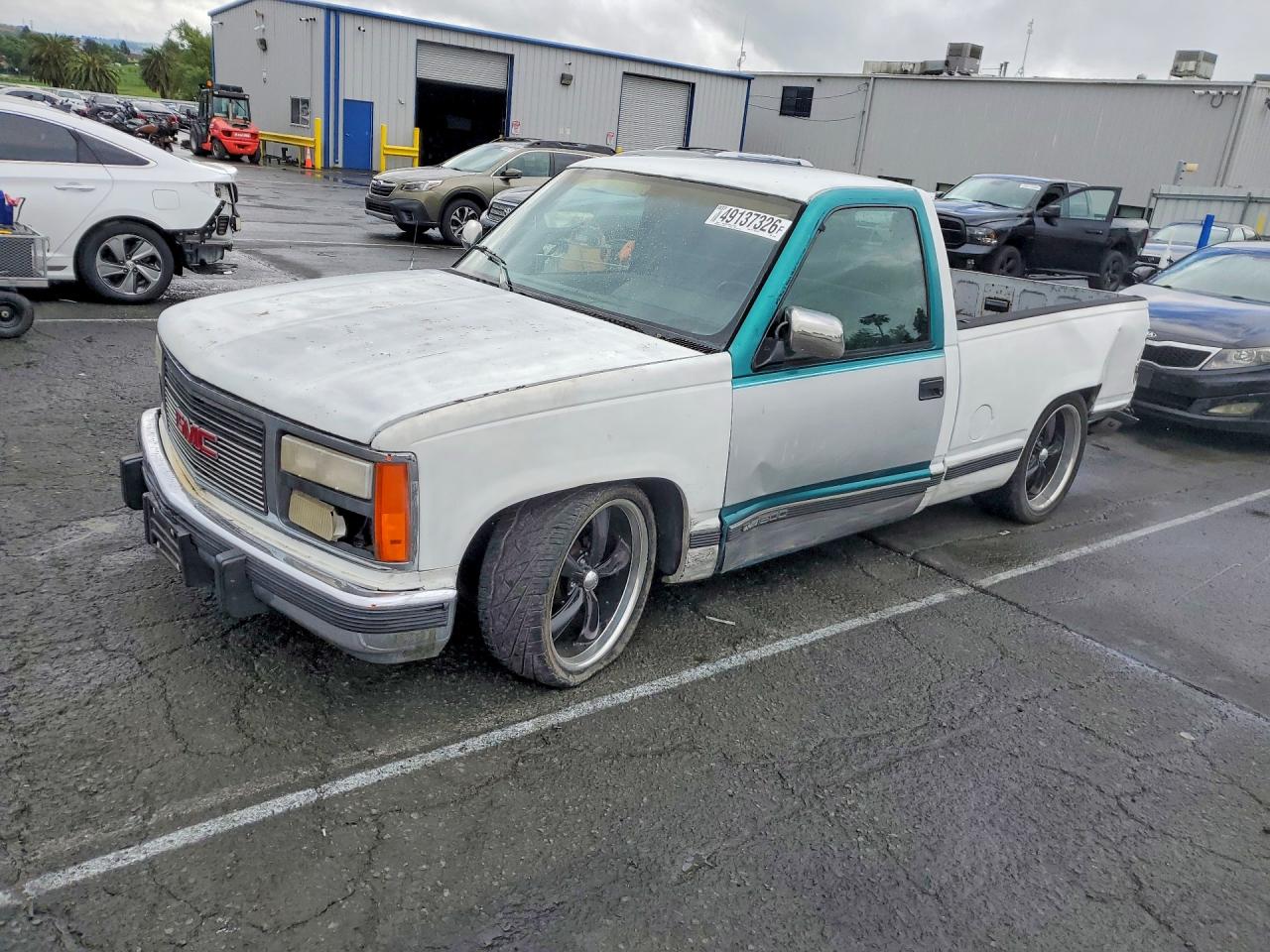 1990 GMC Sierra 1500, VIN 1GTDC14K6LZ552872 — Side