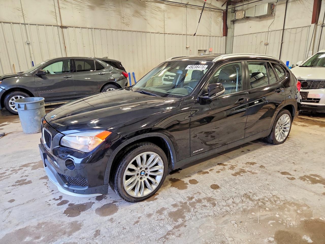 2015 BMW X1 xDrive28i, VIN WBAVL1C53FVY38980 — Side