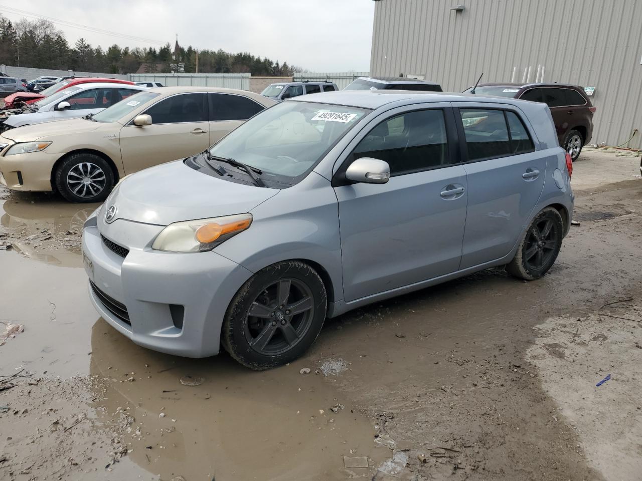 2013 Scion xD, VIN JTKKUPB47D1037299 — Side