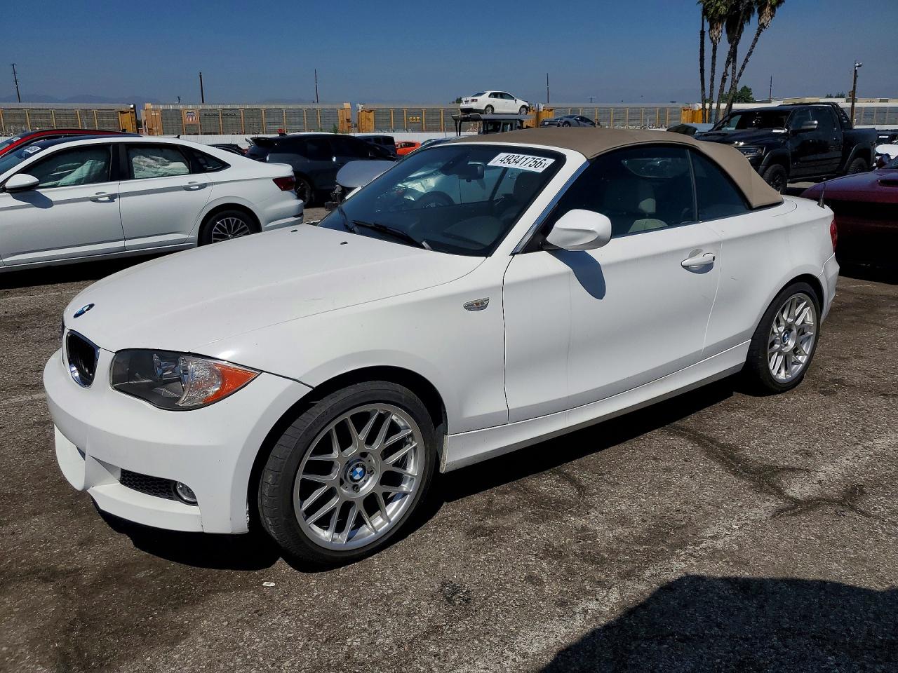 2011 BMW 1 Series 128i, VIN WBAUN1C57BVH83582 — Side