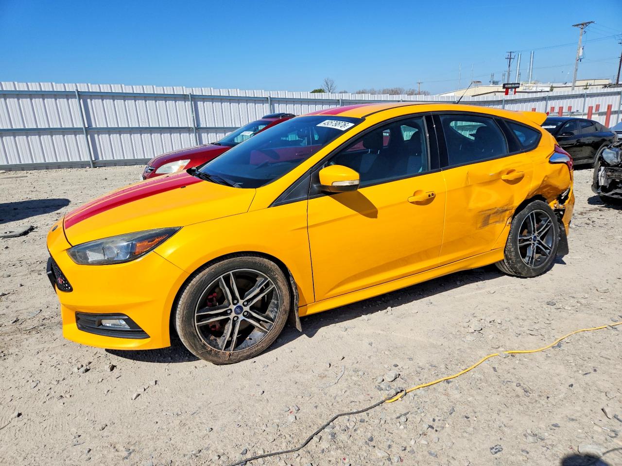 2016 Ford Focus ST, VIN 1FADP3L90GL358139 — Side