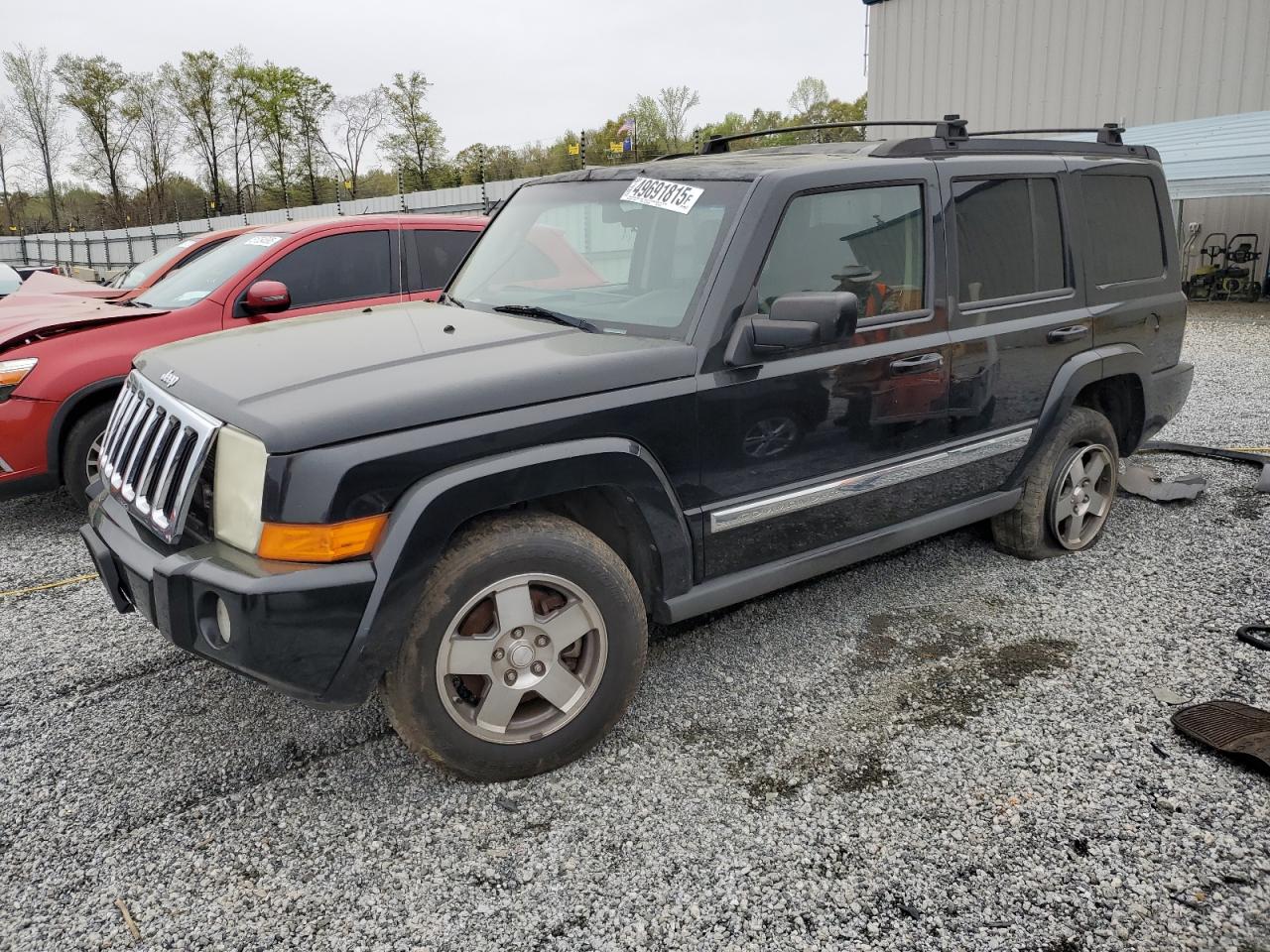 2010 Jeep Commander Sport, VIN 1J4RG4GK1AC105237 — Front end