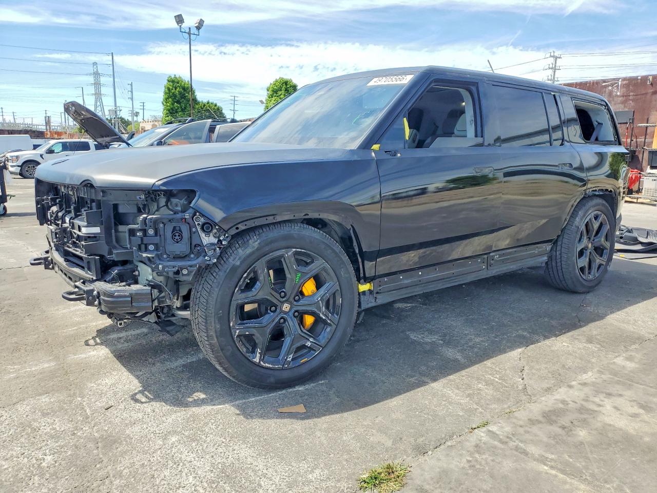 2023 Rivian R1S Adventure, VIN 7PDSGABA1PN028086 — Бок