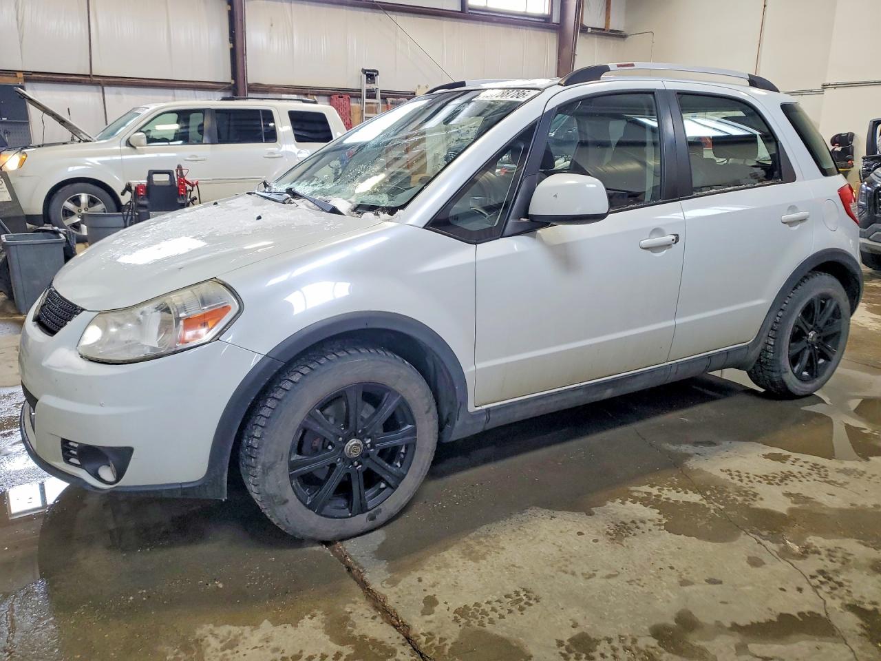 2012 Suzuki SX4 Touring, VIN JS2YB5A71C6300174 — Undercarriage