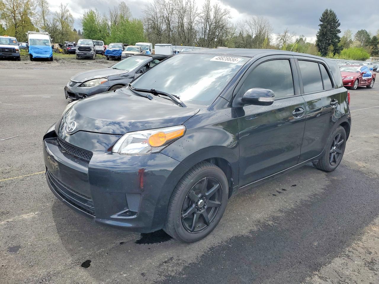 2013 Scion xD, VIN JTKKUPB41D1029120 — Side