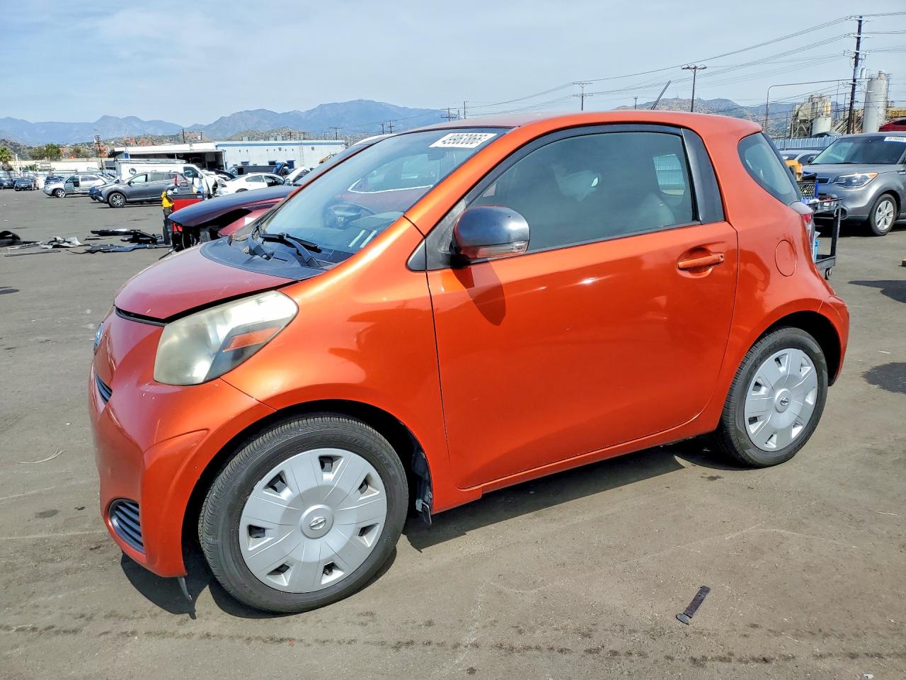 2012 Scion iQ, VIN JTNJJXB04CJ010550 — Side