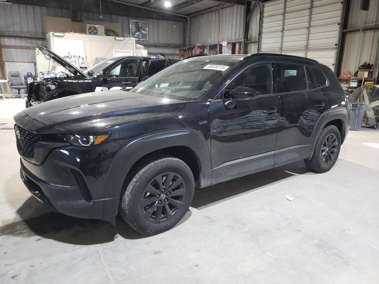 2025 Mazda CX-50 Hybrid Premium Package, VIN 7MMVAADW9SN110297 — Water / flood