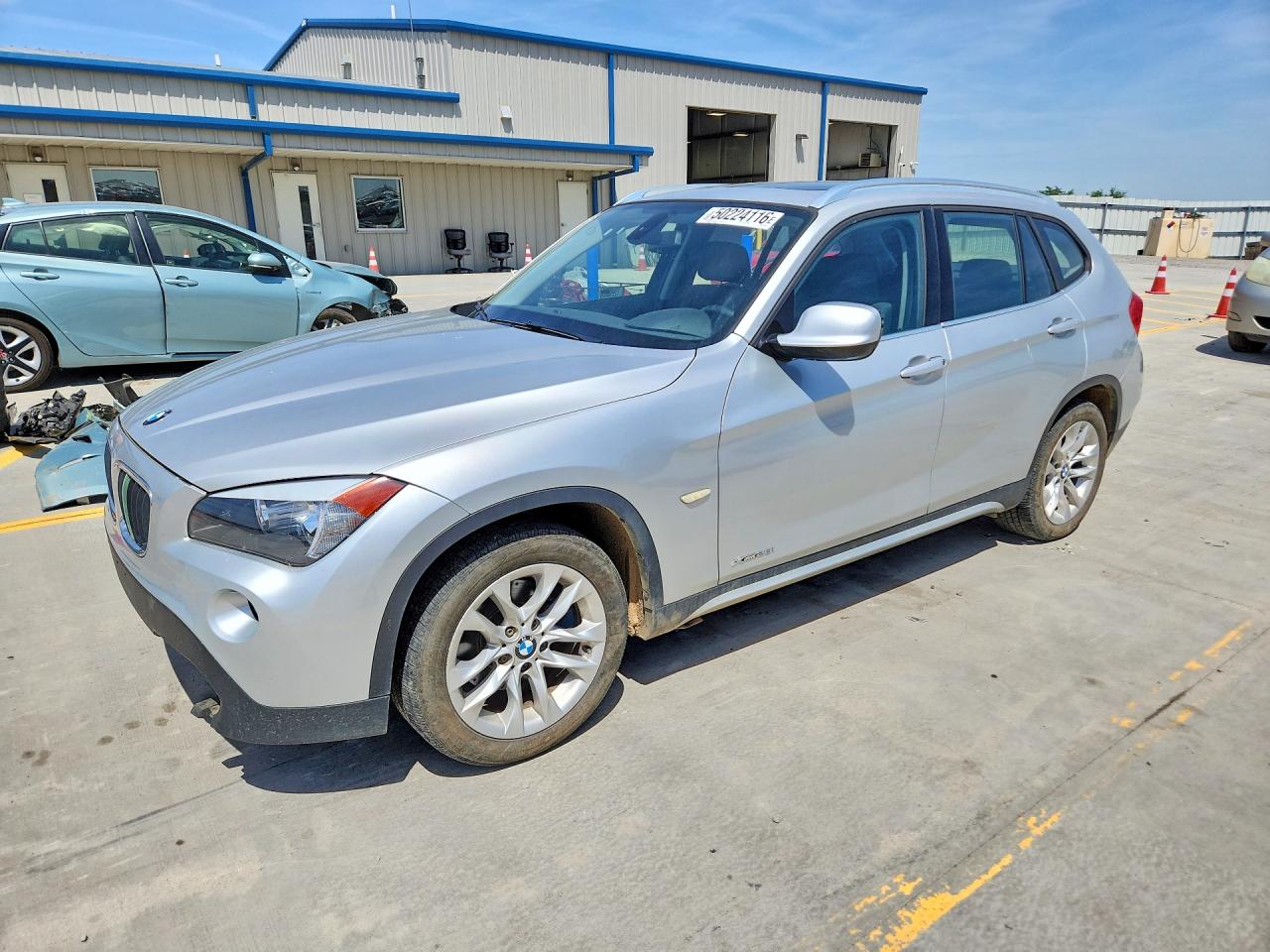 2012 BMW X1 28i, VIN WBAVL1C5XCVR76124 — Undercarriage