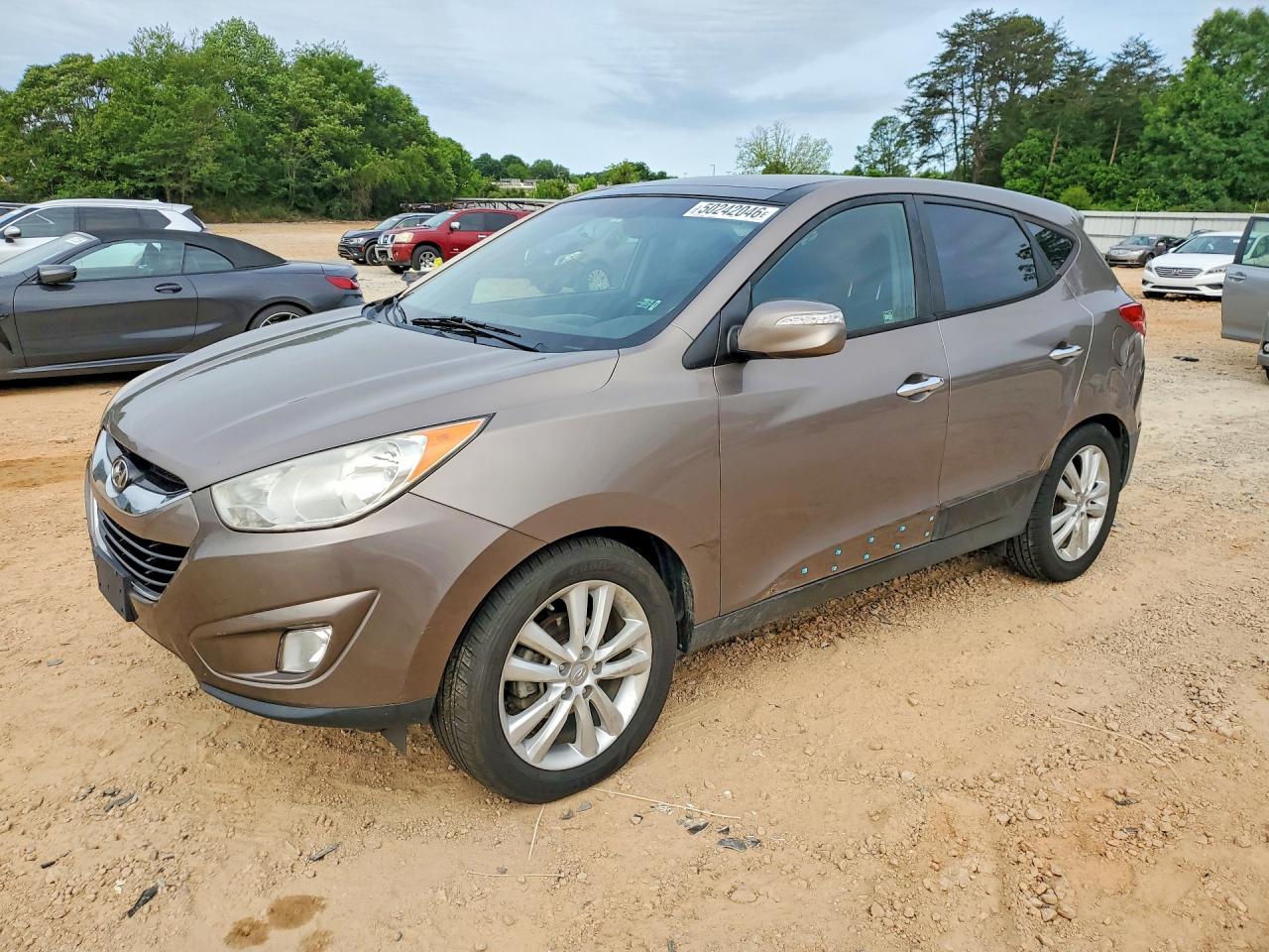 2011 Hyundai Tucson GLS, VIN KM8JU3AC4BU197992 — Side