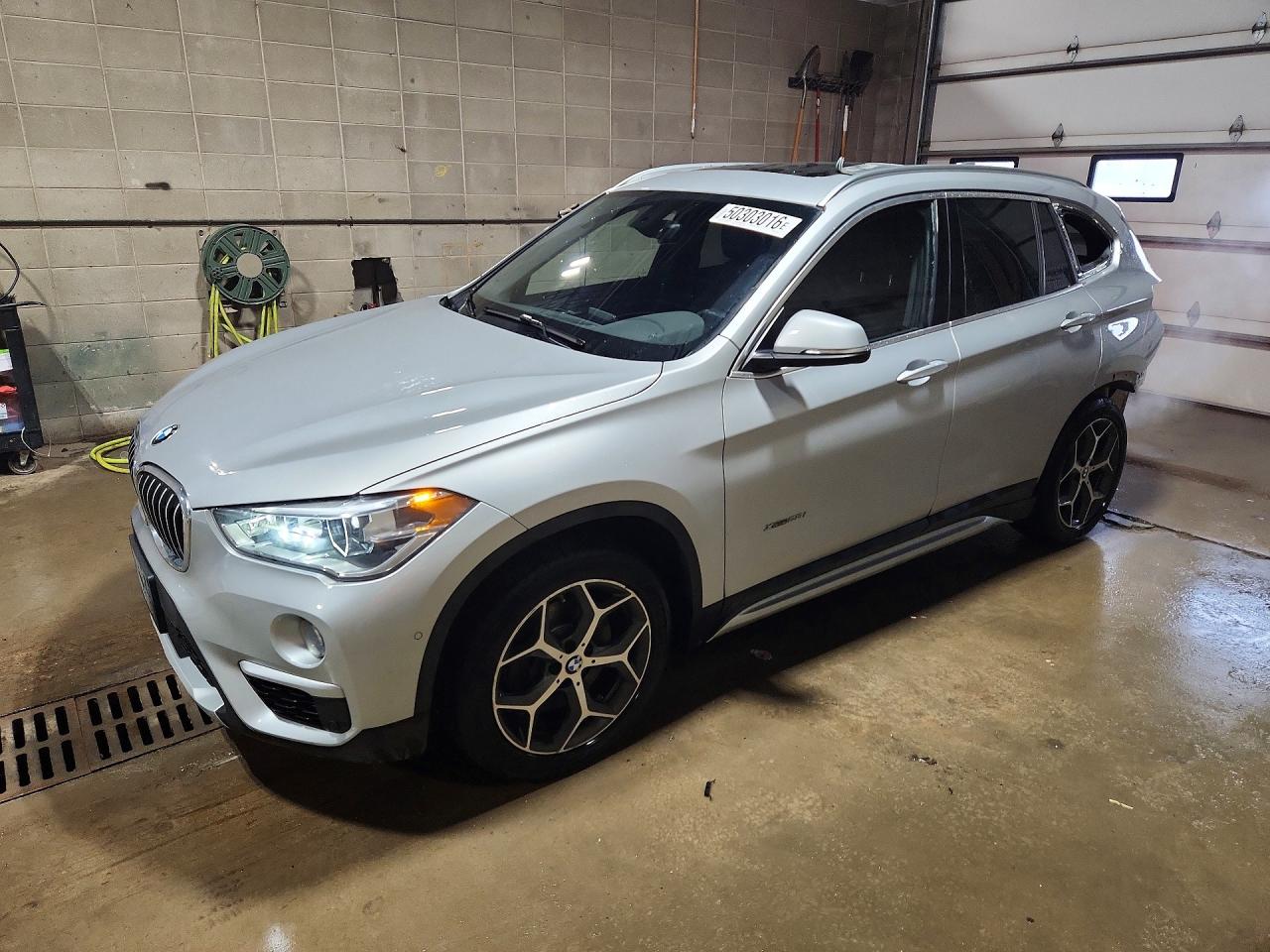 2018 BMW X1 xDrive28i, VIN WBXHT3C34J5K21402 — Rear end